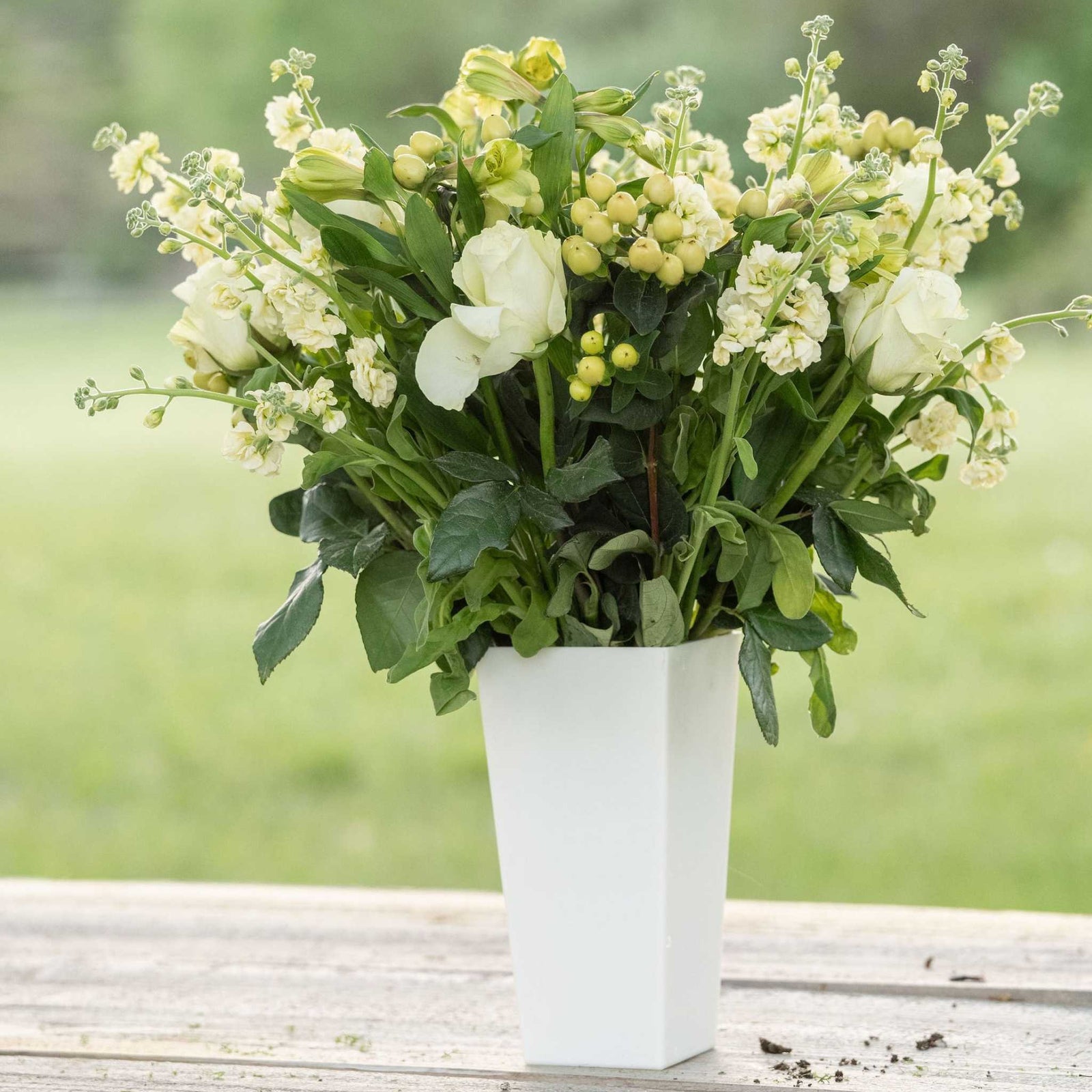pearl tall tapered vase with spring arrangement