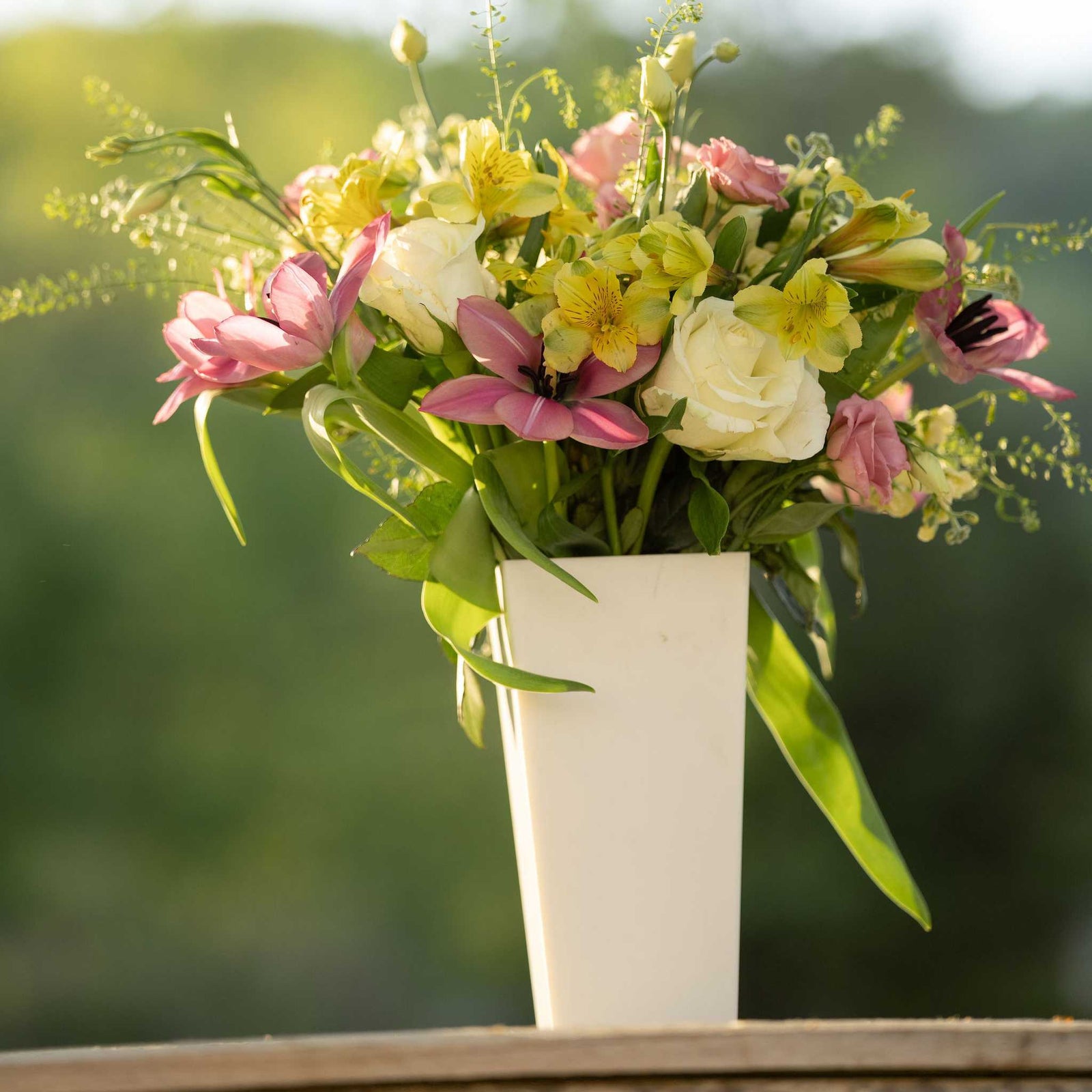 pearl tall tapered vase with spring arrangement