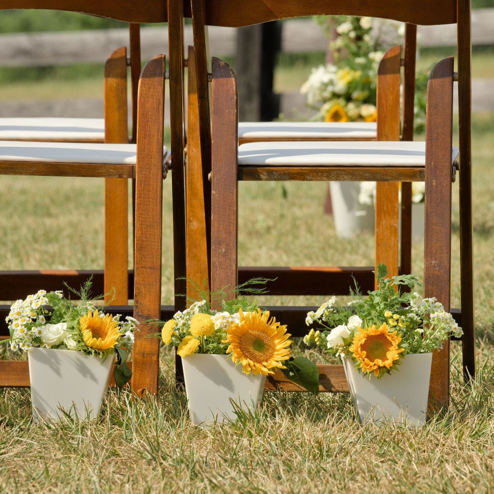 pearl tapered cube near chairs at boho wedding lined up for accent
