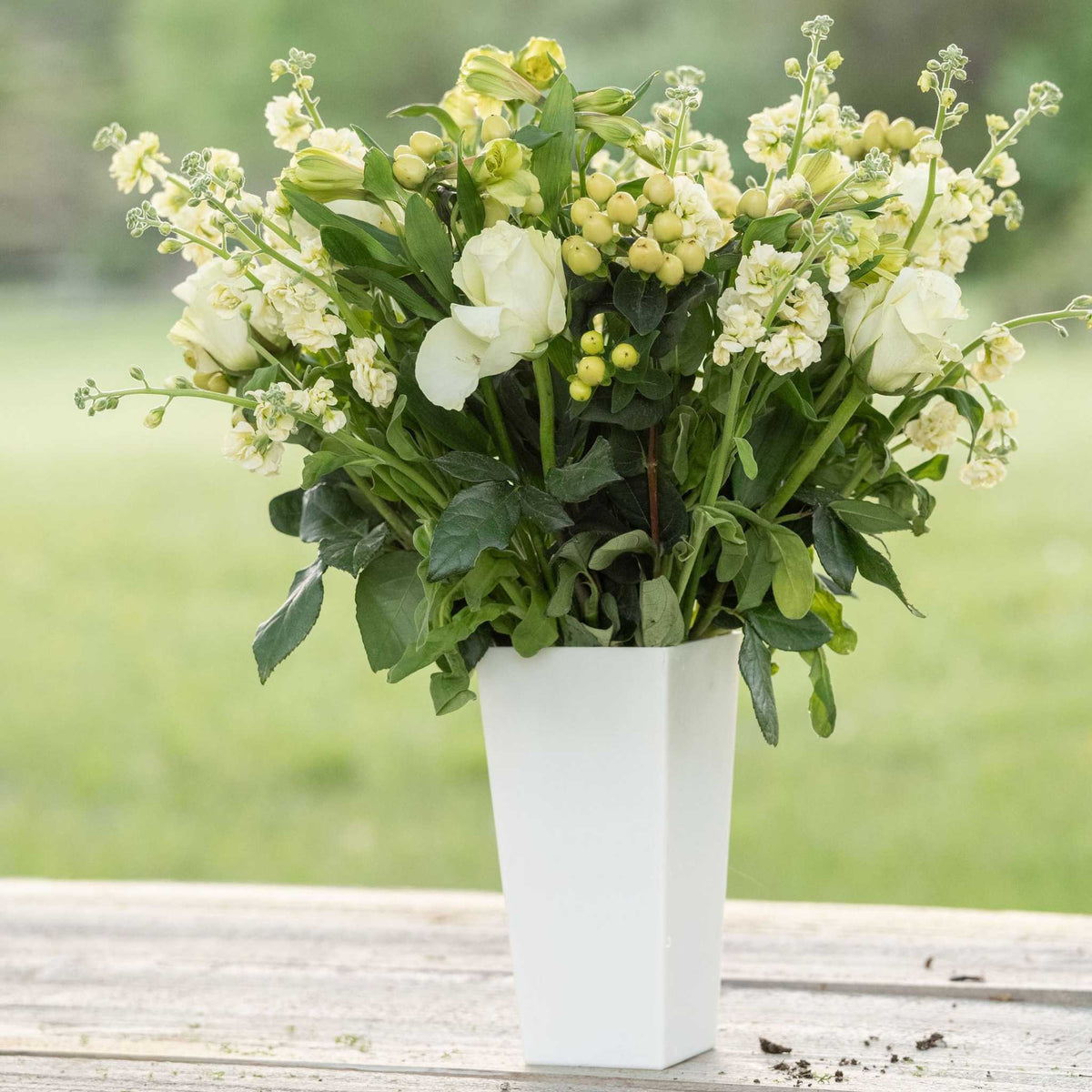 pearl tall tapered vase with spring arrangement