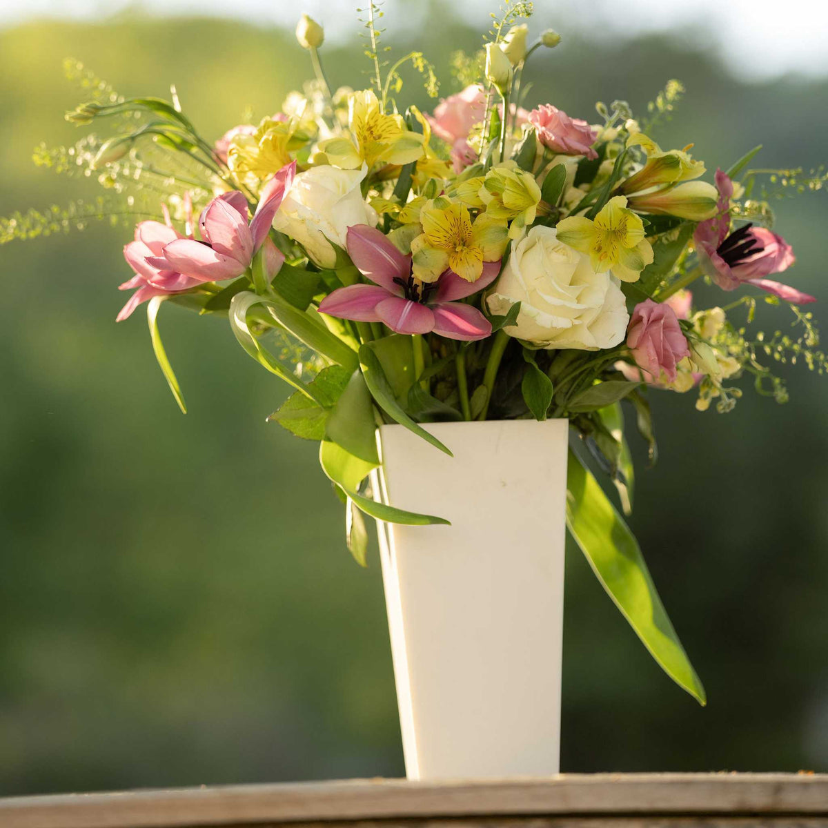 pearl tall tapered vase with spring arrangement