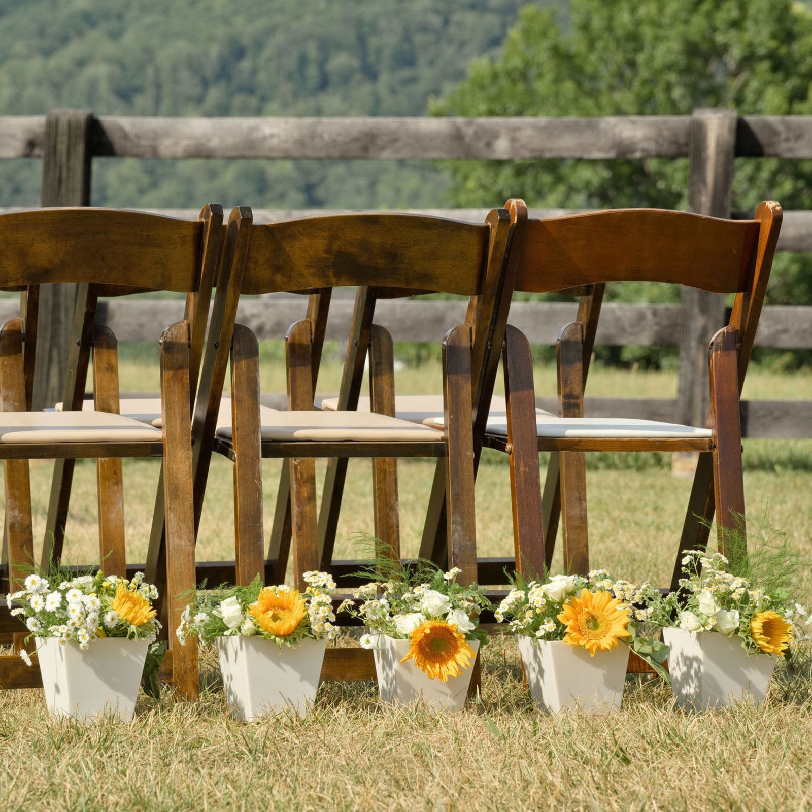 pearl tapered cubes lined up for ceremony at boho wedding near chairs